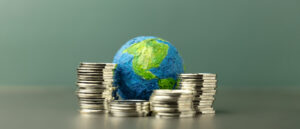 global economy world globe with stacks of coins 2026 03 26 10 38 12 utc